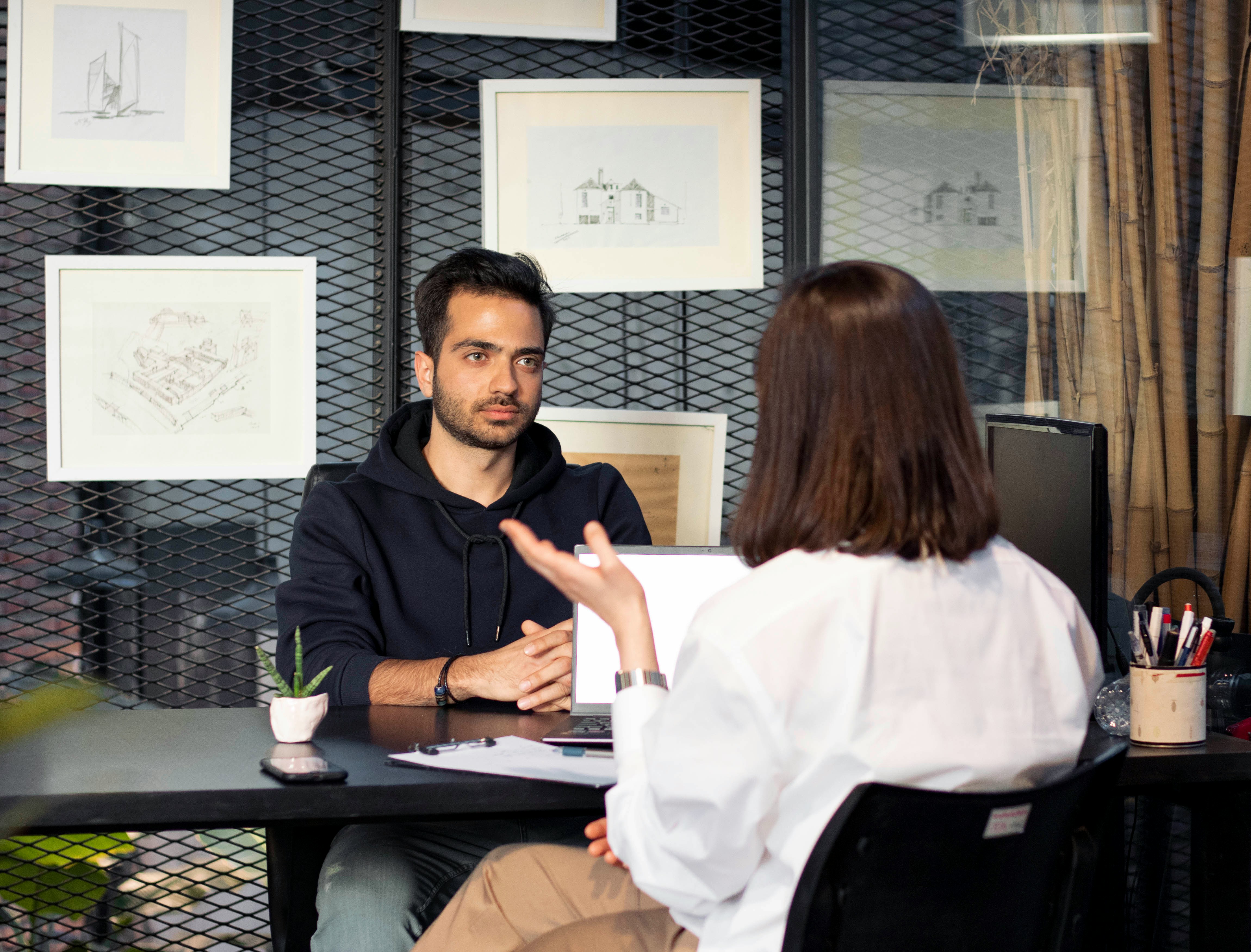 Job interview between two people discussing key selection criteria